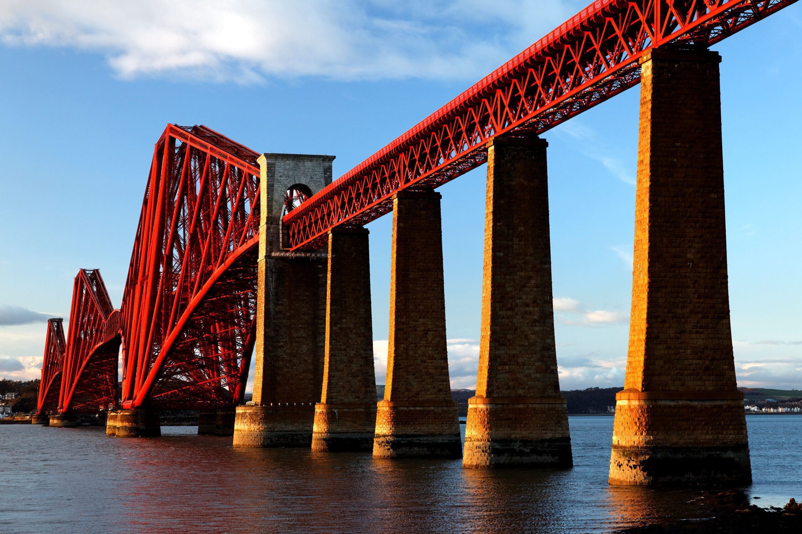 A large red bridge over water