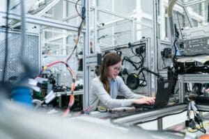 Woman in manufacturing facility working at a bench