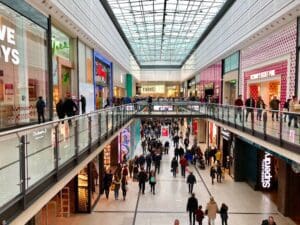 Shoppers walking around Manchester Arndale shopping centre